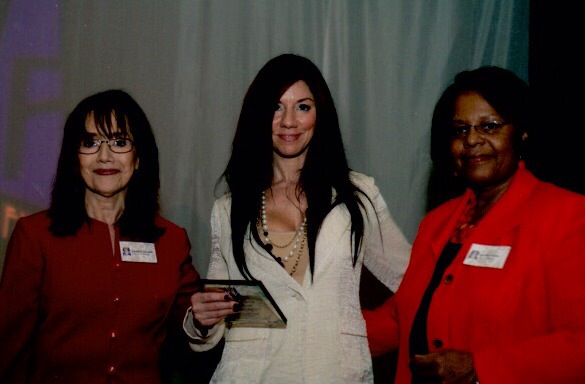 Susan receives the Boston's Women of Action Award from Boston’s Women's Fund President.